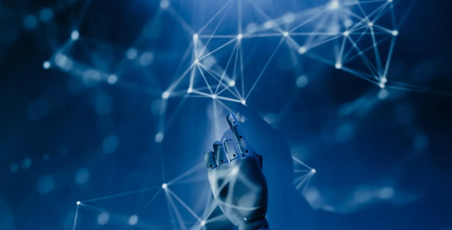 Robotic hand touching a glowing blue network of connected data nodes